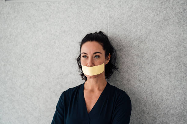 woman-with-tape-over-mouth